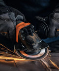 Top Shelf 1400 Watt Angle Grinder Packs Knock Tough 125mm Cutting Muscle in use with sparks flying during metal grinding.