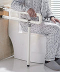 Foldable Toilet Grab Bar For Bathroom Safety, 29.5 Inch Anti Slip Hand Rail, Flip Up Toilet Bar For Elderly And Disabled with person seated
