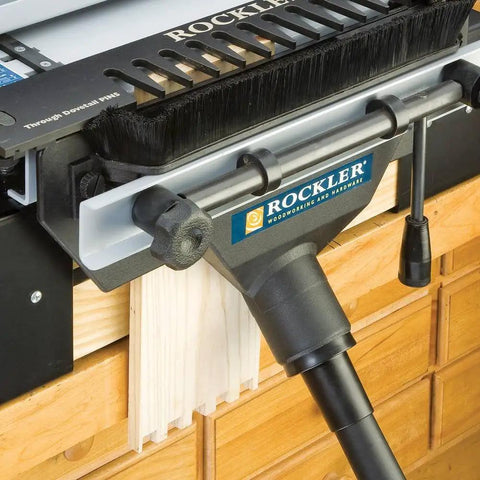 Dust Port Adapter For One And A Quarter Inch Vacuum Wand To Two And A Quarter Inch Port Vacuum Hose Durable Plastic Dust Collector Accessory For Attaching Shop Vac Dovetail Jig And Other Tools connected to a dovetail jig on a workshop table.