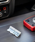 Heavy Duty Left Side Truck Cargo Box Panel Hinges Two Sets on a car console, durable metal for rugged use.