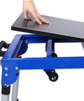 Built Tough Miter Saw Stand And Five In One Folding Portable Workbench With Telescoping Height Legs And Smooth Roll Caster Wheels For Woodworking And Masonry In Blue, showing user adjusting the angle on the surface.