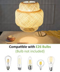Hand Woven Boho Bamboo Pendant Light With Rattan Coastal Charm illuminating a dining space, compatible with E26 bulbs