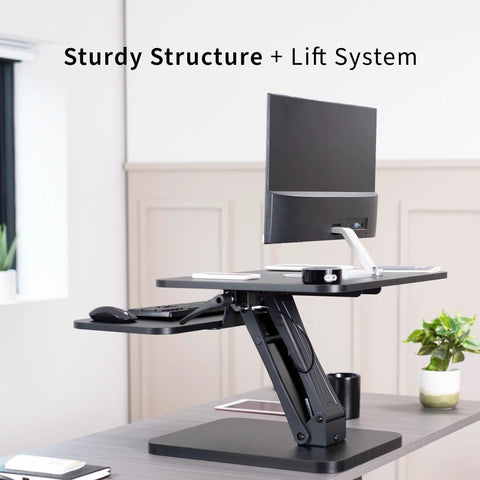 No Brainer Height Adjustable 25 Inch Standing Desk Converter in black with monitor, showcasing sturdy structure in home office.