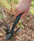 Cordless Cultivator For Lawn And Garden Adjustable Handheld Tiller used on soil, illustrating its aerating function, lightweight black.