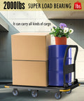Heavy Duty Foldable Platform Cart With Six Wheels And 2000 Pound Capacity loaded with boxes, drum, and plant in warehouse