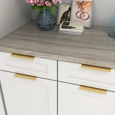 Installed five pack finger edge pulls on white cabinet drawers, brushed brass finish, elegant kitchen tab pulls, six and a quarter inch centers.