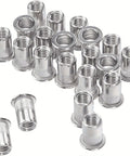 60 Pcs One Quarter Twenty UNC Steel Threaded Rivet Nuts Flat Rivnut Inserts spread out, showing their cylindrical shape.