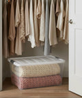 Slick 94 Quart Storage Bins With Secure Lids 8 Pack Bpa Free Clear Plastic Containers storing blankets in a closet.