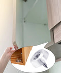 Close-up of 100 pcs clear rubber door stops with screws installed on cabinet door, reducing noise and protecting cabinet surfaces.