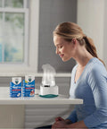 Woman using Personal Steam Inhaler For Targeted Allergy And Cold Congestion Relief Quick 5 To 15 Minute Non Medicated Warm Steam Treatment