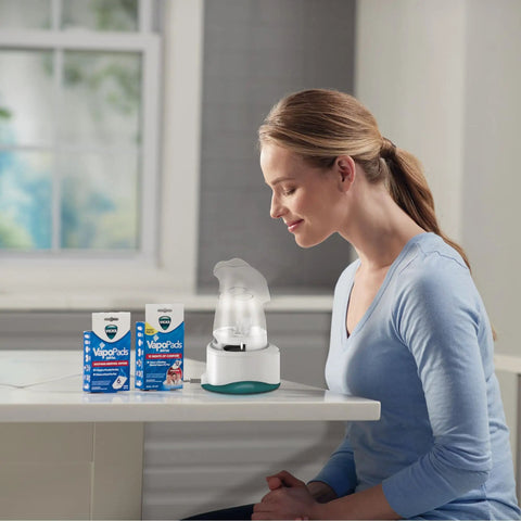 Woman using Personal Steam Inhaler For Targeted Allergy And Cold Congestion Relief Quick 5 To 15 Minute Non Medicated Warm Steam Treatment