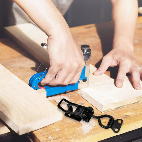 Person using a blue planing tool with a heavy duty adjustable toggle clamp pull latch for tool boxes and industrial equipment