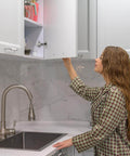 Woman using cabinet with Cabinet Hinge Damper Pack Of 20 For Blum Straight Arm Full Overlay Hinges With Nickel Plated Finish