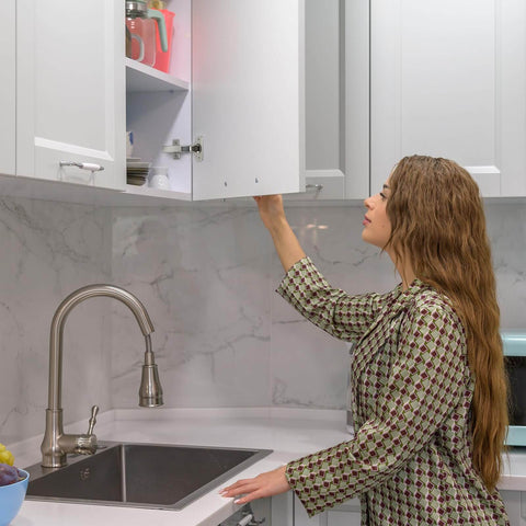 Woman using cabinet with Cabinet Hinge Damper Pack Of 20 For Blum Straight Arm Full Overlay Hinges With Nickel Plated Finish