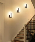 Top Shelf Modern Led Wall Sconces Set Of Two Up And Down Black Metal Fixture With 3000K Warm White Glow illuminating a staircase.