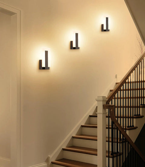 Top Shelf Modern Led Wall Sconces Set Of Two Up And Down Black Metal Fixture With 3000K Warm White Glow illuminating a staircase.
