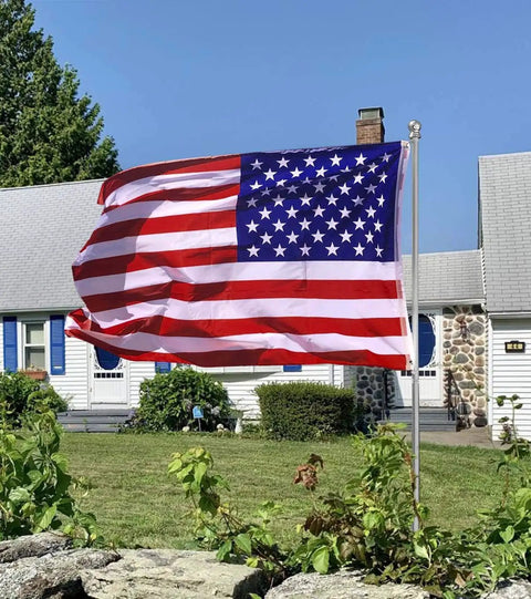 All American Patriotic 3x5 Ft Outdoor Flag With Brass Grommets displayed in garden, durable polyester for home decor