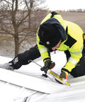 Person applying All Weather Clear Roof Sealant 10.5 Oz Cartridge Pack Of Twelve Waterproof Leak Stopper on metal roof.