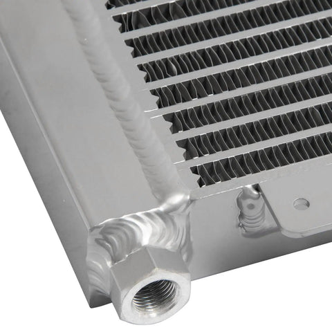 Heavy Duty Transmission Oil Cooler For Trucks And Vans Up To 40K GVW With Low Pressure Drop Direct Fit Upgrade Your Ride Today. Brazed aluminum cooler close-up, threaded fitting and fins
