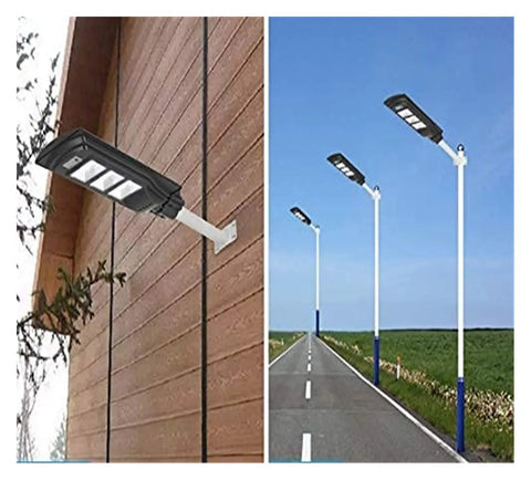 Badass Heavy Duty 350W Solar Floodlight With Photocensor And Motion Sensor mounted on a wall and poles along a road.