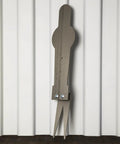Spring Loaded 28 Inch AR500 Steel Popper Target With Three Eighths Inch AR400 Base against white wall, side view.