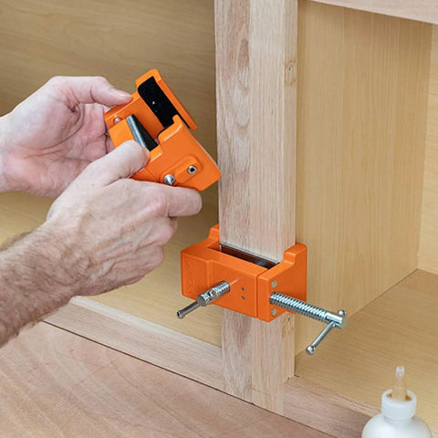 Person using Badass Cabinet Clamps 2 Pack For Real Woodworking Projects With Flip Side Pilot Drill Guide Heavy Duty Aluminum Build 440 Pound Holding Power Fits One Point Five To Two Inch Door Stiles on wooden panel.