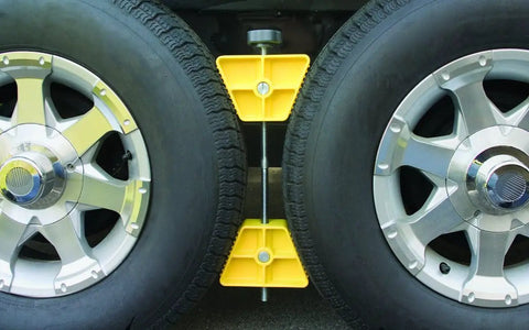 RV Wheel Stop For Trailers Lightweight Heavy Duty Tire Stabilizer With Rubber Handle That Prevents Tandem Tire Shifting When Parked Or Rehitching Keeps Your Rig In Place On 26 To 30 Inch Tires installed between dual RV tires