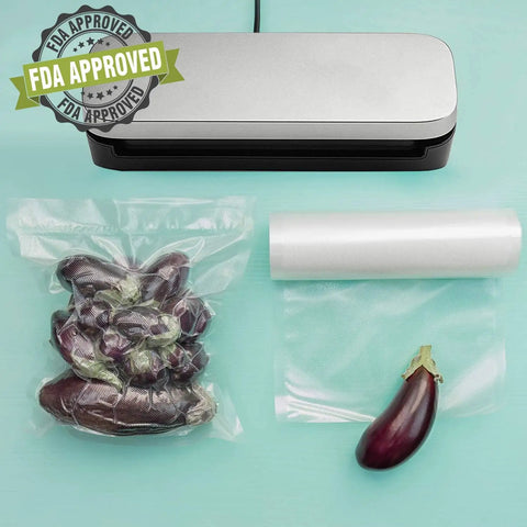 Heavy Duty Vacuum Sealer Bags Set Featuring Two Handy Sizes 11x20 And 8x20 Inches with vegetables and sealer on table.