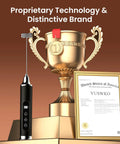 Rechargeable Milk Frother Wand For Coffee Handheld Electric Whisk IPX6 Waterproof One Touch Self Cleaning Cordless Drink Mixer Easy Clean Foaming On Point For Lattes Cappuccinos And More For Coffee Lovers Black next to a trophy.