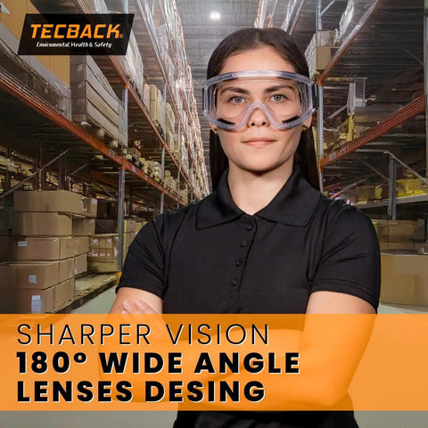 Person wearing Over Glasses Safety Goggles For Work And Lab Pro Grade Anti Fog Anti Scratch Clear Lenses Splash Resistant Eye Protection Vented Design ANSI Z87.1 Certified Perfect For Chemistry Industrial And Healthcare Environments in warehouse environment