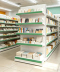 Heavy Duty Adjustable Gondola Shelving Unit Rock Solid Reinforced Steel Double Sided Retail Rack displays stationery products in a store aisle.