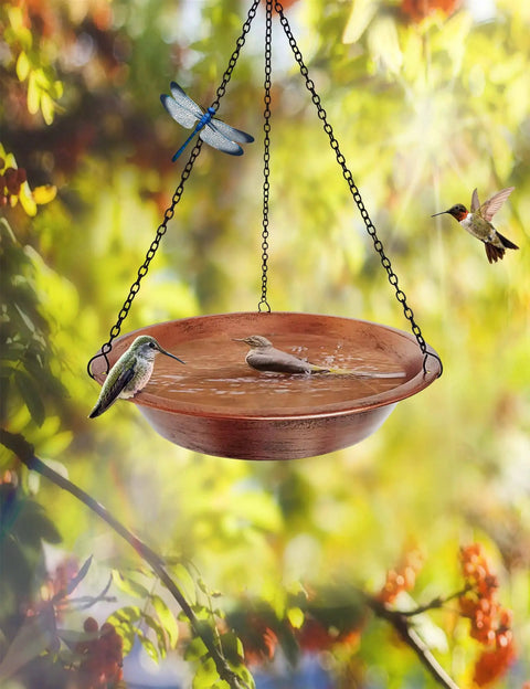 Outdoor Hanging Bird Bath In Antique Copper Metal With 17 Inch Rust Proof Black Chains, surrounded by birds and foliage.