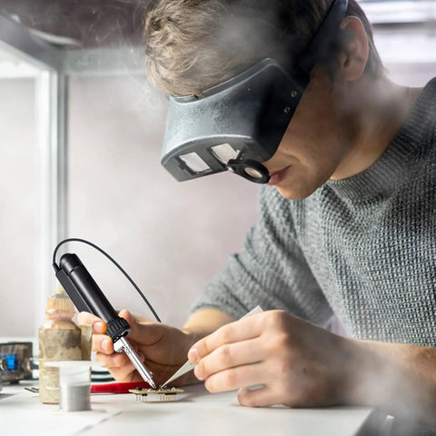 Person using Automatic Desoldering Pump With Pro Grade Power, Solder Sucker Vacuum, Portable 30W Desoldering Iron Tool at a workstation