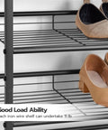 Close-up of black metal wire shelves with shoes on a five tier shoe rack organizer for entryway with adjustable tilt and feet.