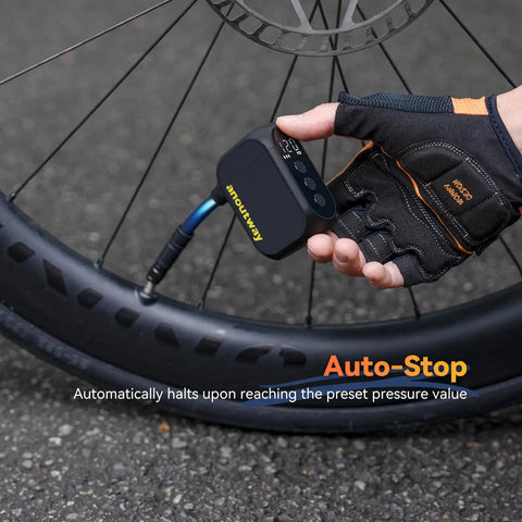 Cyclist using On-The-Go Mini Bike Pump With Gauge to inflate tire, showing Auto Stop feature and real-time pressure display.
