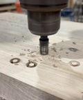 Pro Level Tapered Plug Cutter Drill Bit With A Badass Four Flute Design drilling into wood, creating tapered plugs for joinery.