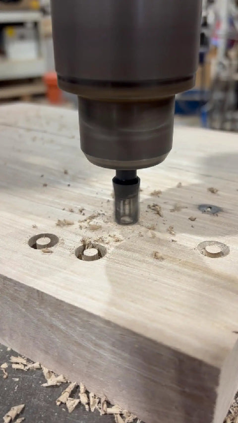 Pro Level Tapered Plug Cutter Drill Bit With A Badass Four Flute Design drilling into wood, creating tapered plugs for joinery.