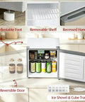 Inside view of Slick Compact 1.1 Cu Ft Mini Freezer With Smooth Five Step Temperature Control And Reversible Door, showcasing removable shelf and adjustable foot.
