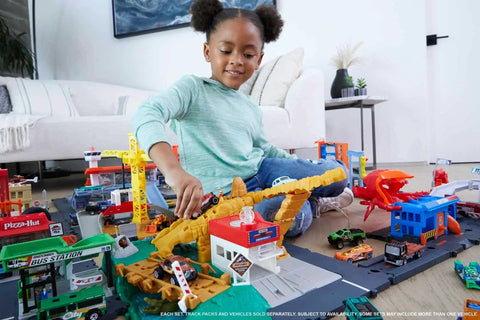 Child playing with City Scorpion Flex Attack Track Set featuring 1:64 scale police vehicle and bendable tail for car chase action.