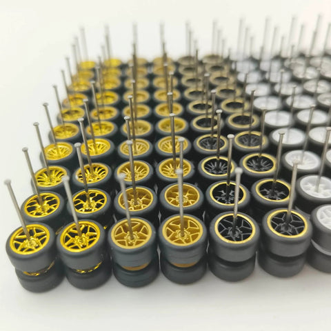 Close-up of 10 Pack 1/64 Diecast Car Wheels And Tires Set With Mixed Rubber Tires for Custom 1/64 Models, showing various rims and axles.