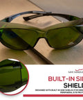 Built Tough Kickass IR3 Welding Safety Glasses With Anti Fog And Anti Scratch Wrap Around Lenses UV Shield Flexible Fit ANSI Z87 Certified Smooth Vision For Daily Grind Case Of 144 Units on a workbench.