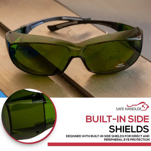 Built Tough Kickass IR3 Welding Safety Glasses With Anti Fog And Anti Scratch Wrap Around Lenses UV Shield Flexible Fit ANSI Z87 Certified Smooth Vision For Daily Grind Case Of 144 Units on a workbench.