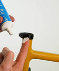 Applying Crystal Grease For Bicycles 100 Percent Waterproof Clear Non Staining Lubricant to bike part from 3.5 ounce tube.