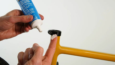 Applying Crystal Grease For Bicycles 100 Percent Waterproof Clear Non Staining Lubricant to bike part from 3.5 ounce tube.