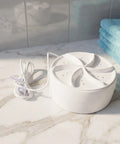 Chill Road Trip Ready Mini Turbo Washer Built For Real Deal RV Campers And Frequent Travelers on a marble countertop with towels.