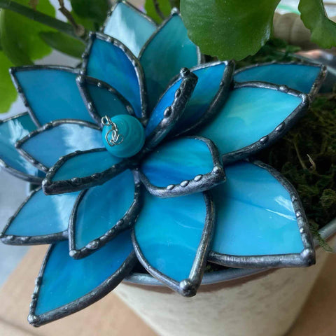 Blue stained glass flower with six petals, part of the Stained Glass Soldering Jig 4 Layer Flower Mold Set for succulent art.