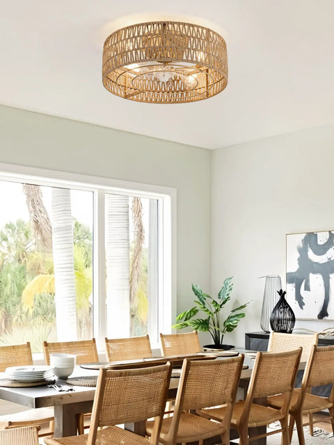 Retro BoHo Flush Mount Ceiling Fan With Open Caged Design And Integrated Warm Led Lighting, hanging over a dining table.