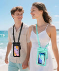 Couple on beach wearing Waterproof Phone Pouch 2 Pack Up To Eight Point Eight Inches Double Bag IPX8 Case Built For Outdoors