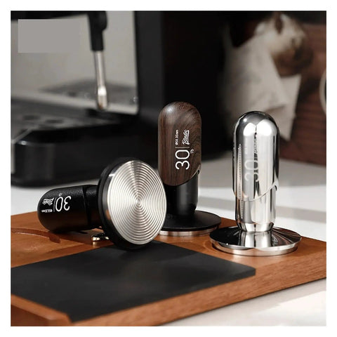 No Drama 2 In 1 Coffee Tamper And Constant Pressure Espresso Distribution Tool With Calibrated Spring For Even Powder Pressing and Flawless Puck Prep In 58mm Silver displayed with various tamper designs.