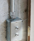 Six Pack Three Quarter Inch EMT Offset Connectors UL Listed Galvanized Steel Conduit Fittings installed on wall junction box